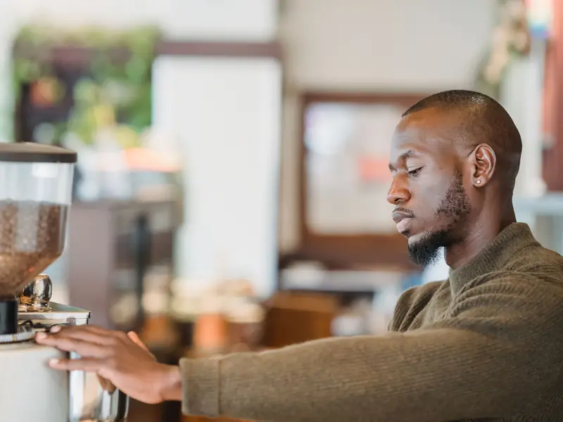 A barista at a cafe counter